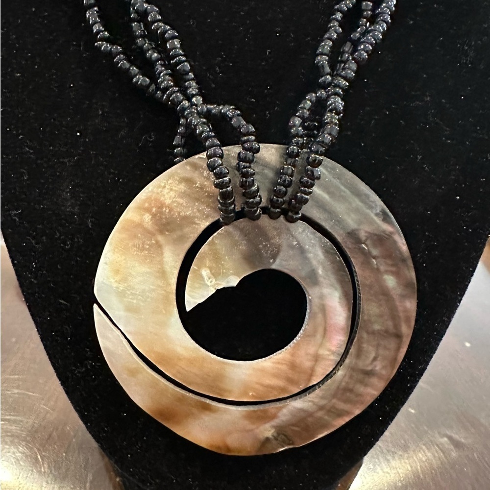 Iridescent White Mother Of Pearl Pendant
With Black Beads - Picture 2 of 3